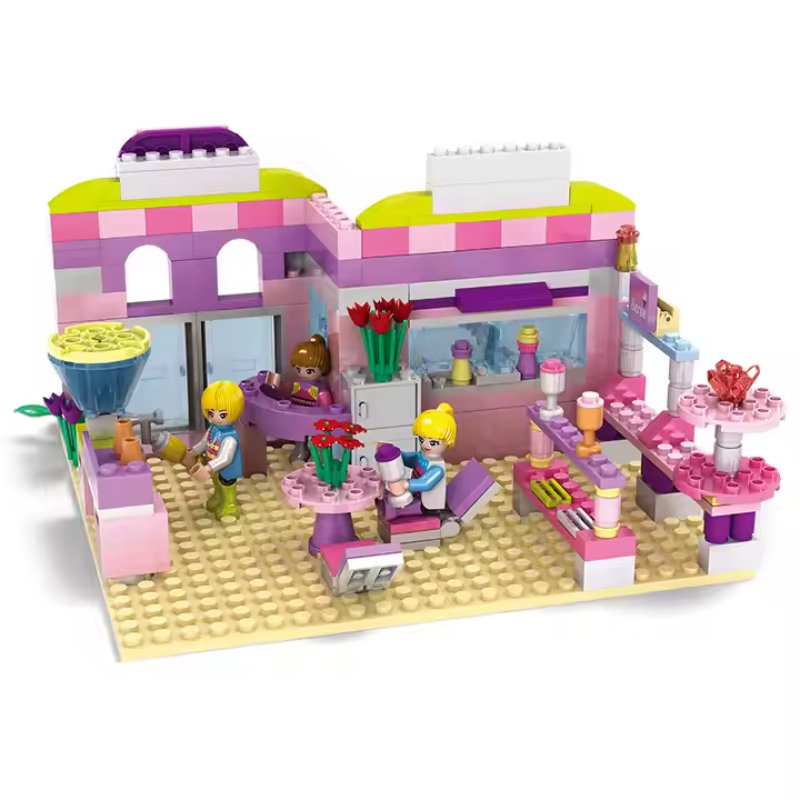 LEGO-style Bricks Box Friends City Café set with mini figures, a café building, tables, and accessories.